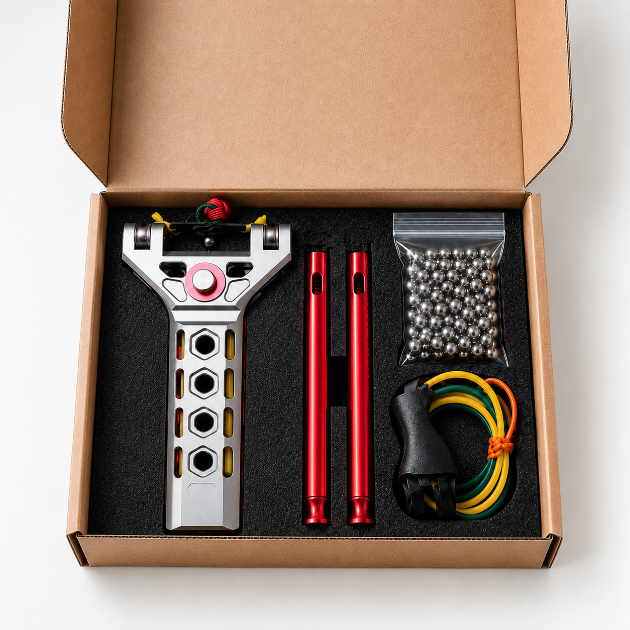 Kit APEX PRECISION™ organizado na caixa com esferas, elásticos e tubos de armazenamento